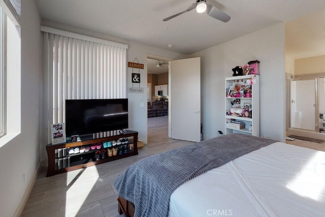 bedroom featuring ceiling fan and baseboards