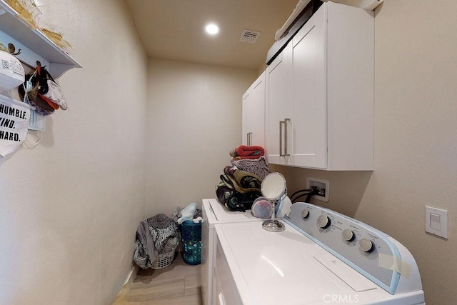 laundry area with cabinet space, visible vents, washer and clothes dryer, and recessed lighting