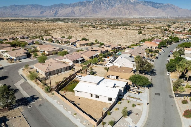 drone / aerial view with a residential view and a mountain view