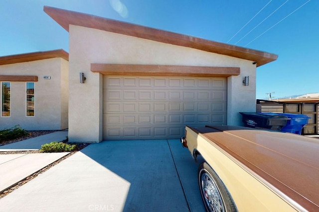 garage featuring driveway