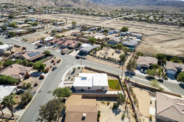 bird's eye view with a residential view and a mountain view