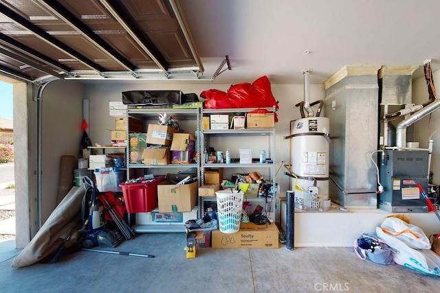 storage area with a garage and strapped water heater