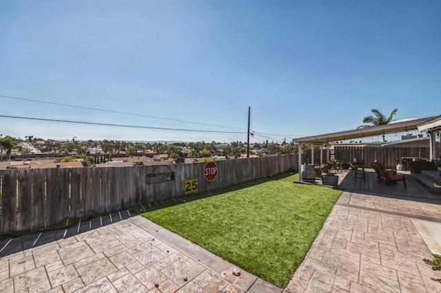 view of yard featuring a fenced backyard and a patio