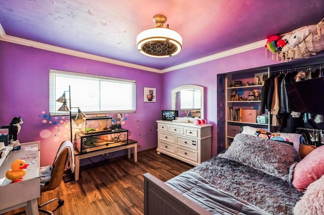 bedroom with dark wood finished floors and crown molding