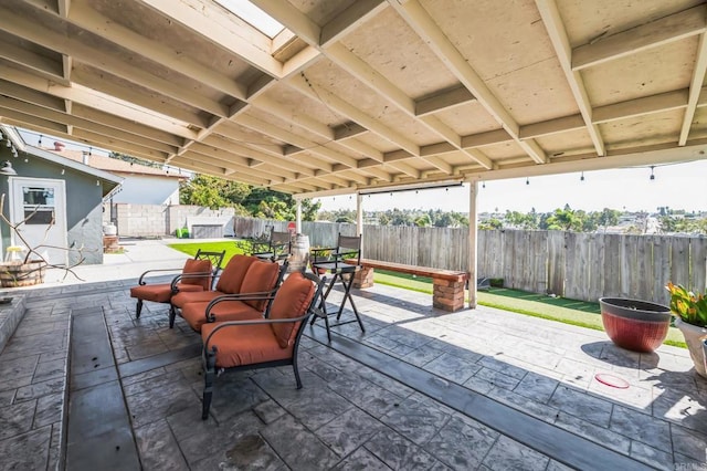 view of patio featuring outdoor dining area and a fenced backyard