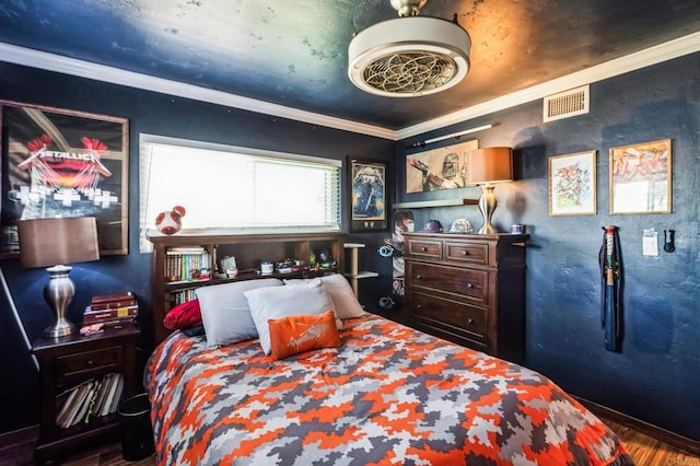 bedroom with visible vents and crown molding