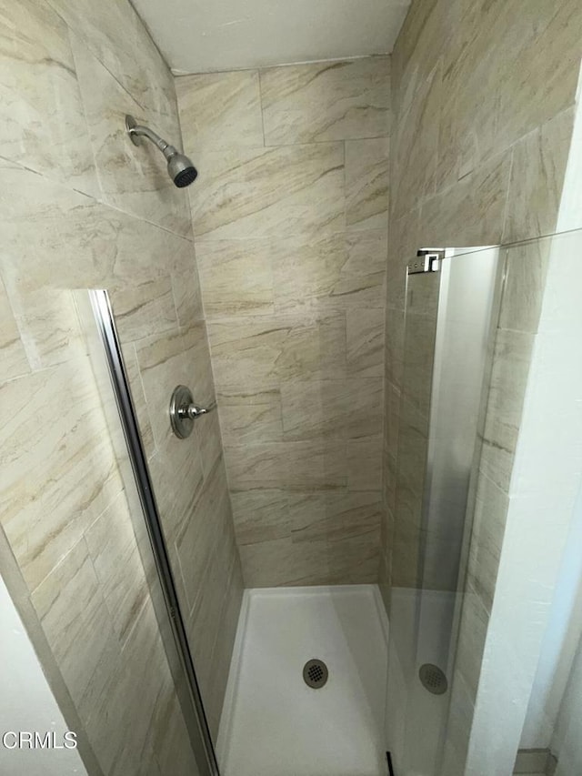 bathroom with a shower stall