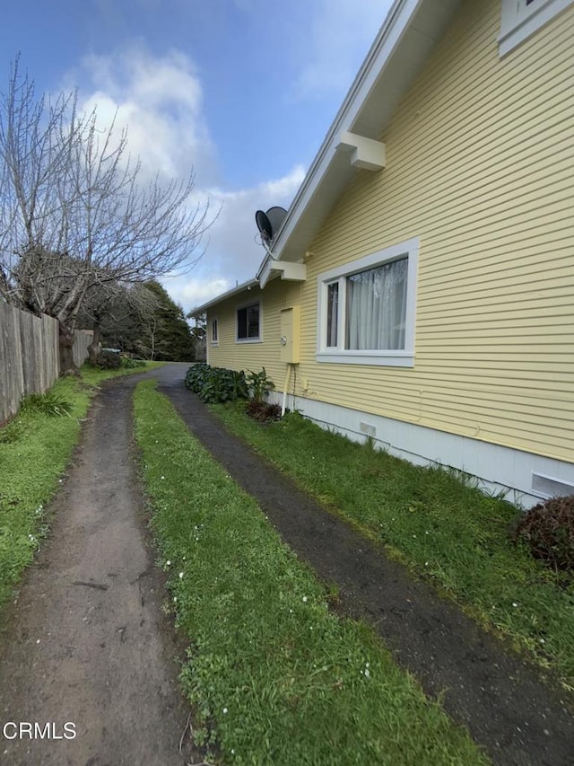 view of property exterior featuring fence