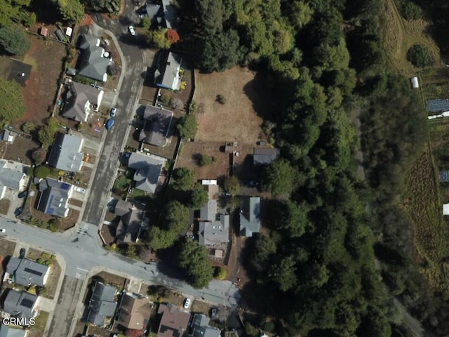 birds eye view of property with a residential view