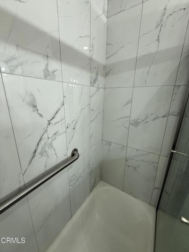 bathroom with a bath and walk in shower