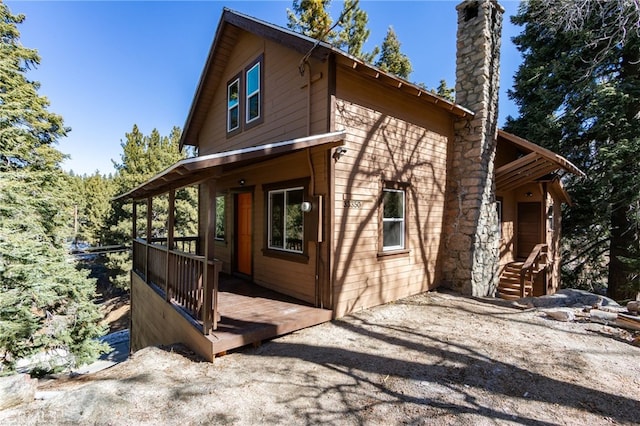 view of property exterior featuring a chimney