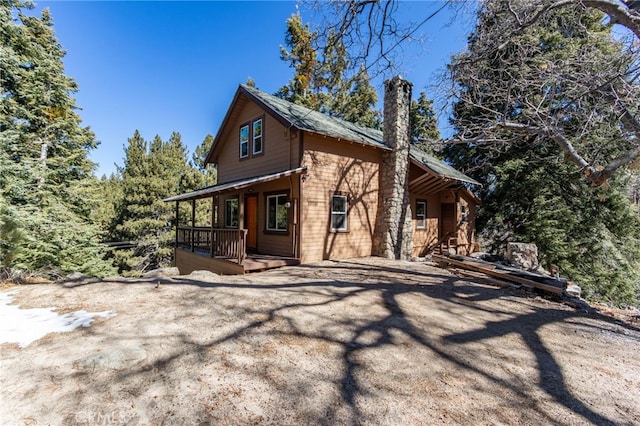 view of property exterior featuring a chimney