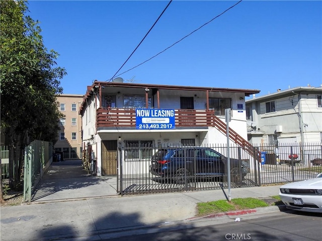 view of building exterior with fence