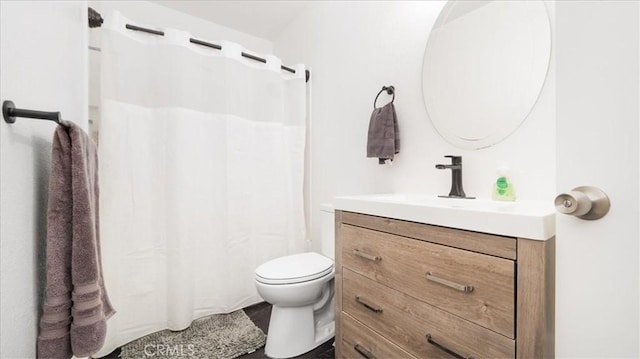 full bathroom with toilet and vanity