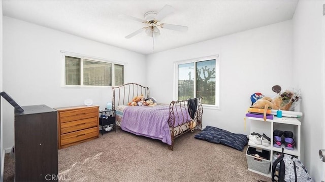 bedroom with carpet and a ceiling fan