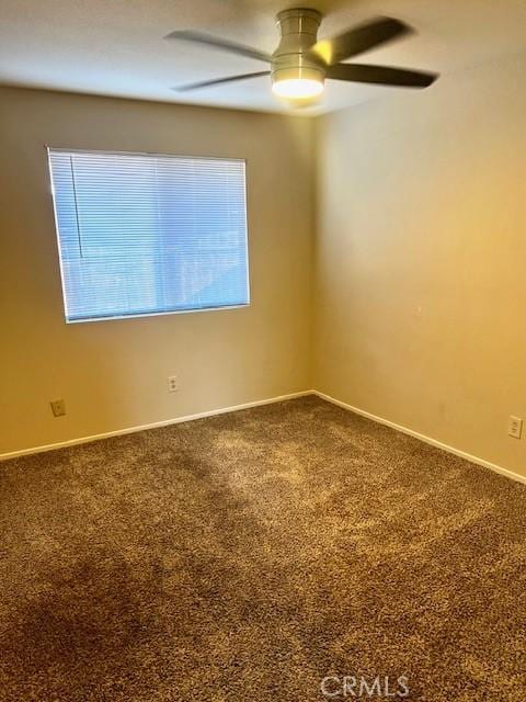 spare room with a healthy amount of sunlight and carpet