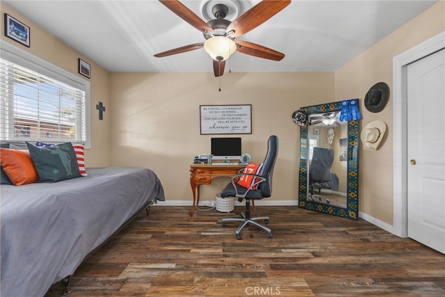 bedroom with dark wood finished floors, baseboards, and ceiling fan