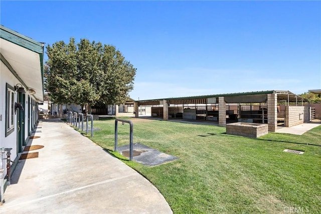 view of yard with an outbuilding and an exterior structure