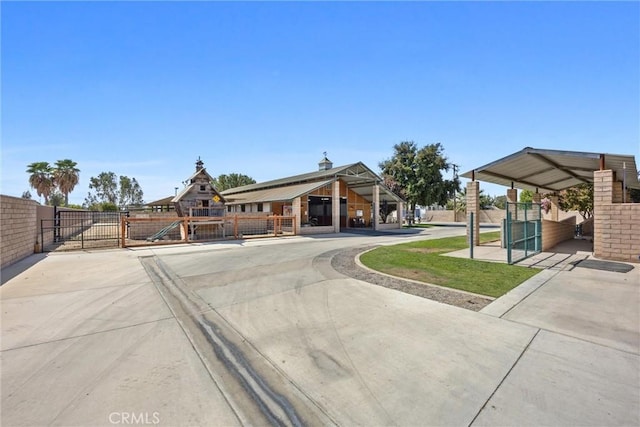 exterior space featuring a gate and fence