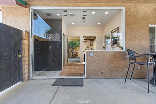 interior space with a patio and visible vents