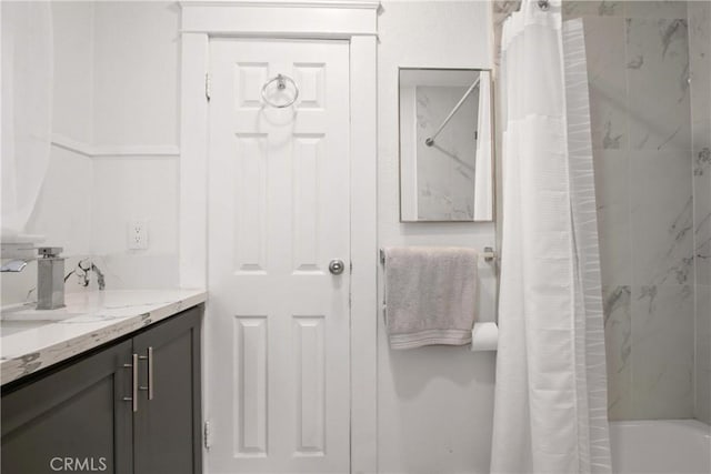 bathroom featuring vanity and shower / bath combo