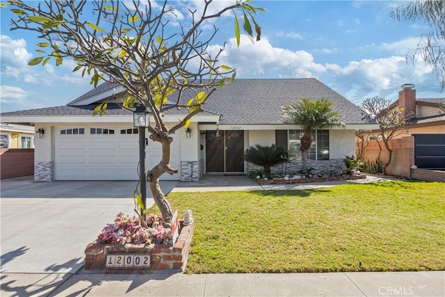 view of front facade with an attached garage, stone siding, driveway, stucco siding, and a front lawn