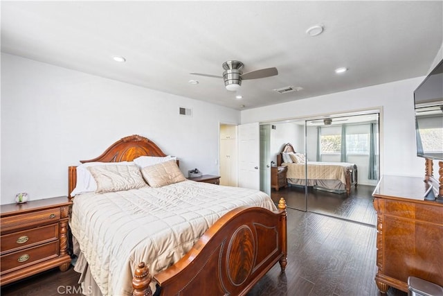 bedroom with dark wood-style floors, ceiling fan, visible vents, and recessed lighting