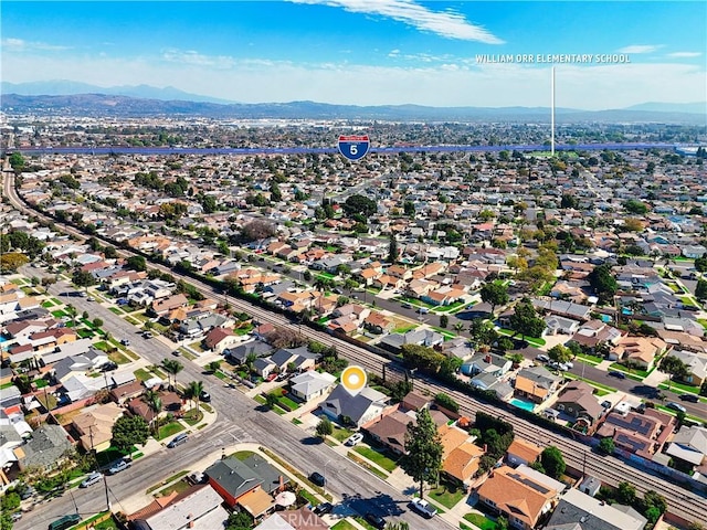 drone / aerial view with a mountain view and a residential view