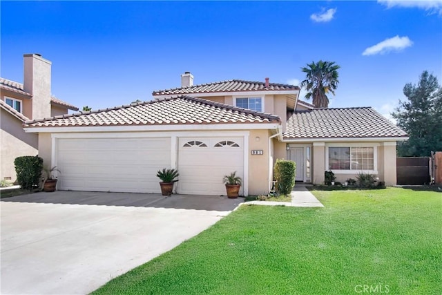 view of front of house with a tile roof, a front yard, a garage, and stucco siding