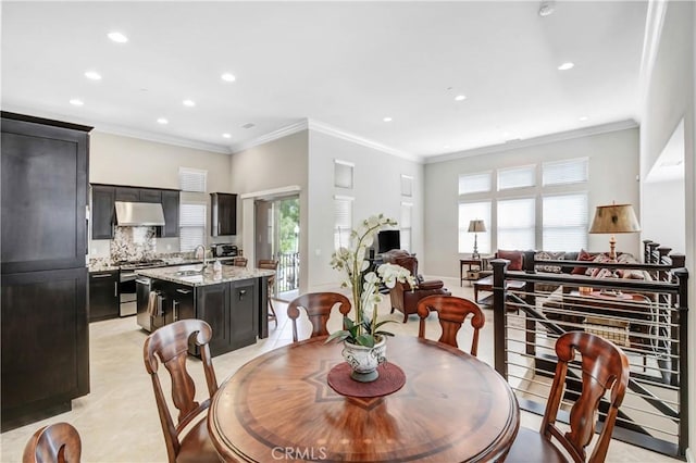 dining space with light tile patterned floors, crown molding, and recessed lighting