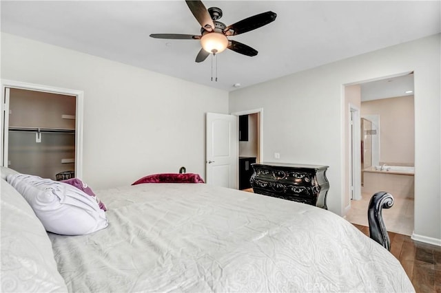 bedroom with ceiling fan and wood finished floors