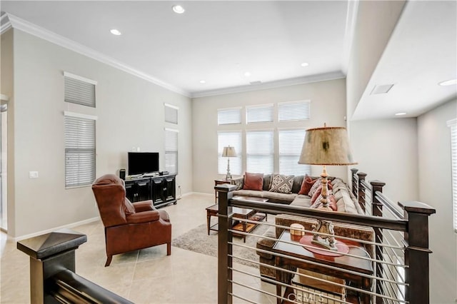 living room with light tile patterned floors, ornamental molding, recessed lighting, and baseboards