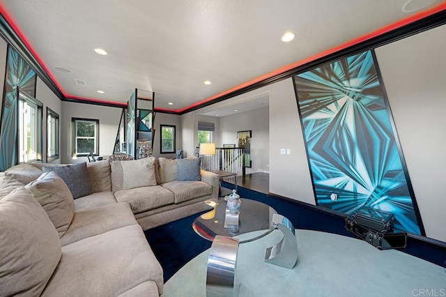 living room featuring visible vents, crown molding, and recessed lighting