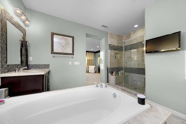 ensuite bathroom with a garden tub, visible vents, a stall shower, vanity, and ensuite bath