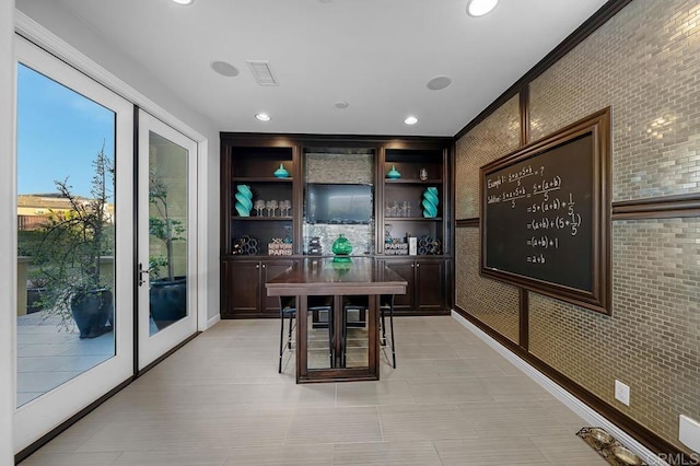 bar featuring brick wall, visible vents, and recessed lighting