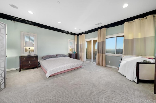 bedroom with ornamental molding, light colored carpet, and baseboards