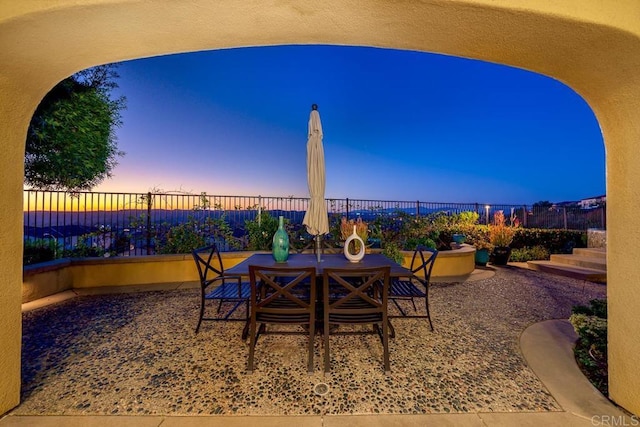 view of patio with outdoor dining space and a fenced backyard