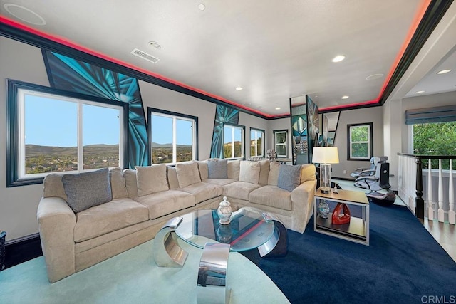 living area featuring a mountain view, recessed lighting, visible vents, baseboards, and crown molding