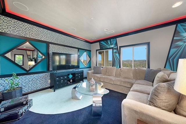 carpeted home theater room featuring recessed lighting, visible vents, and crown molding