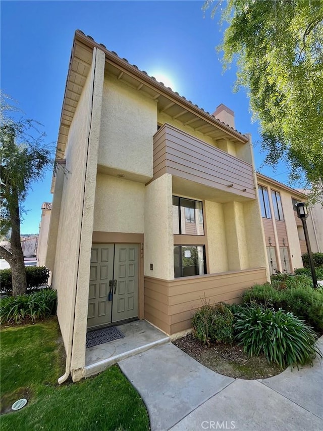 exterior space with stucco siding