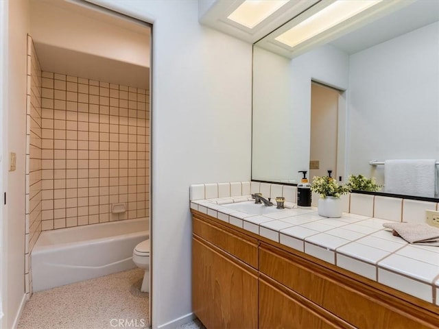 bathroom with toilet, shower / tub combination, and vanity