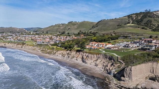 mountain view with a water view, a residential view, and a view of the beach