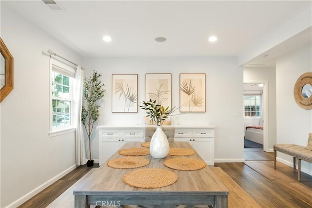 dining area with dark wood-style floors, recessed lighting, visible vents, and baseboards