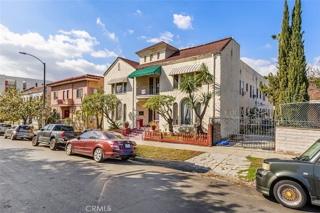 view of property featuring a residential view and fence