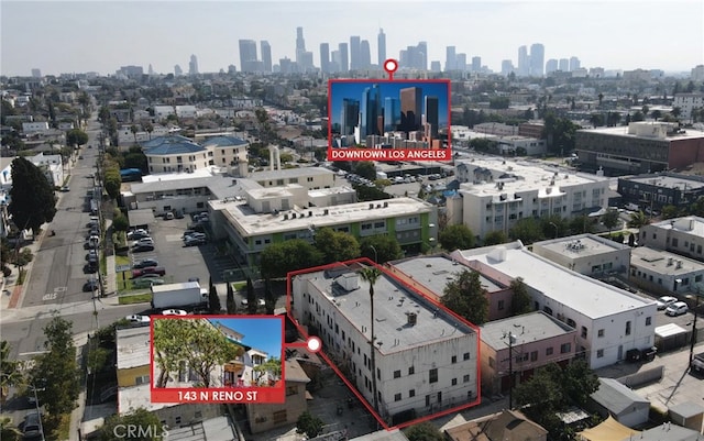 birds eye view of property featuring a city view