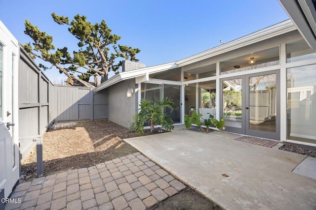 view of patio / terrace with fence and french doors