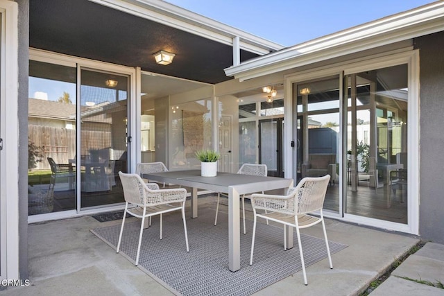 view of patio featuring outdoor dining area