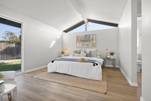 bedroom featuring vaulted ceiling with beams, access to outside, baseboards, and wood finished floors