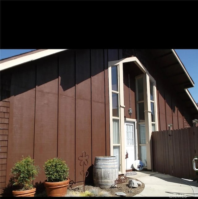 view of property exterior featuring fence