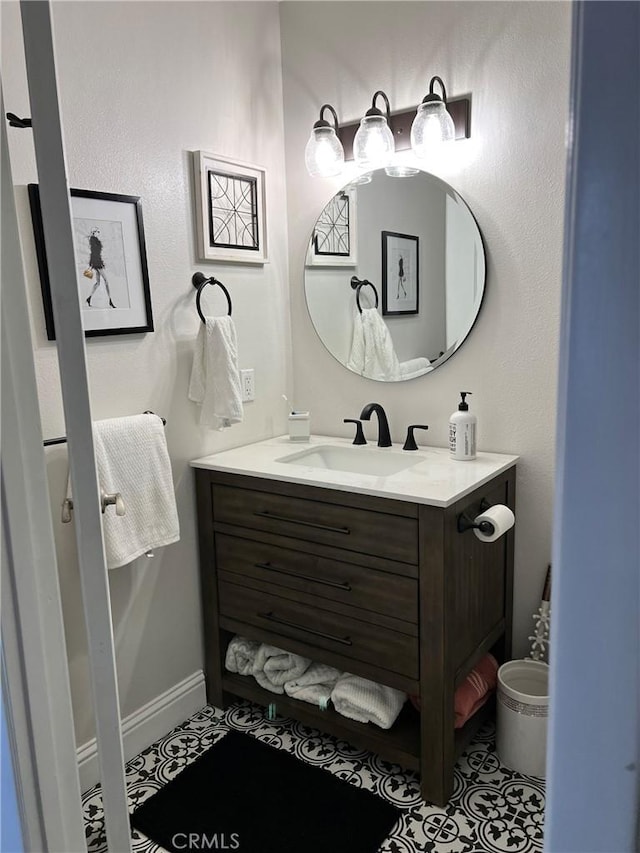 bathroom with tile patterned flooring and vanity